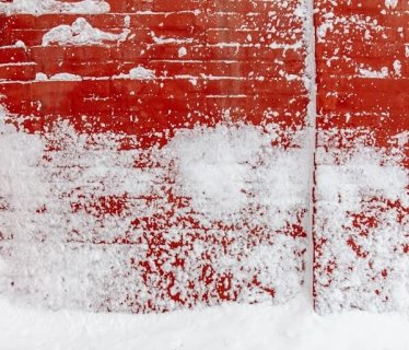 Snow on red brick
